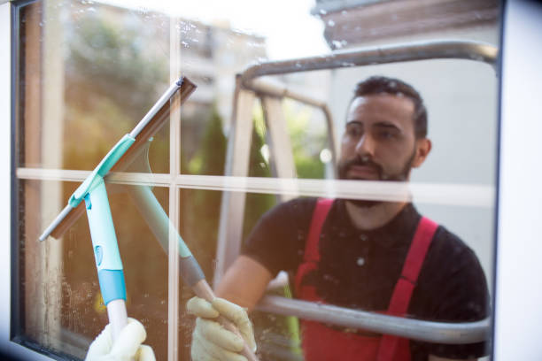 istock Window cleaner doing his job carefully 1071046710