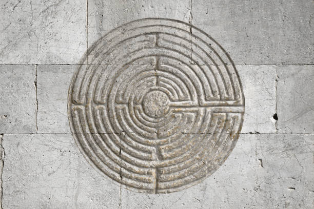 istock Romanesque labyrinth carved on a stone wall - concept image 1071050230