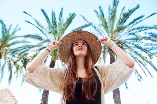 istock Young girl in a straw hat smiles 1071057182