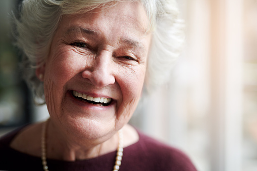 Portrait of a happy senior woman indoors