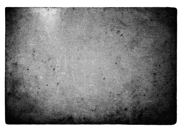 istock Black and white film frame with light leaks and grain isolated on white background. 1071065424