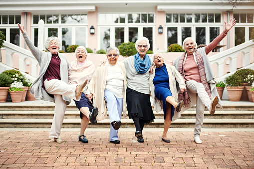 Portrait of a group of senior women having fun together outdoors