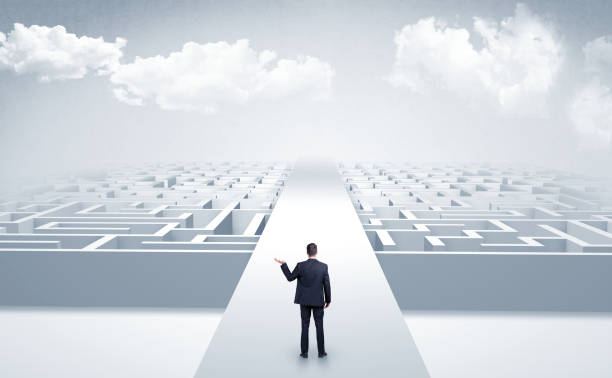 istock Businessman going straight on two mazes 1071067080