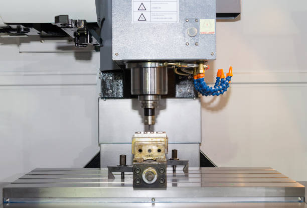istock High precision CNC machining center working, cutting die metal mold process 1071068318