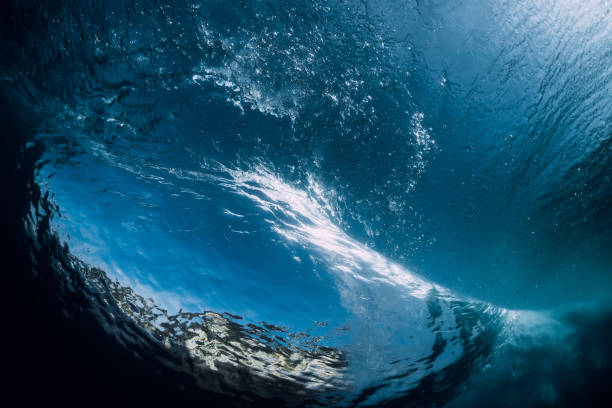istock Underwater wave. Ideal barrel wave crashing in ocean. 1071069760