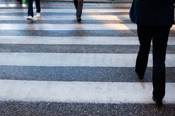 istock People crossing street, motion blur, on zebra crossing 1071072318