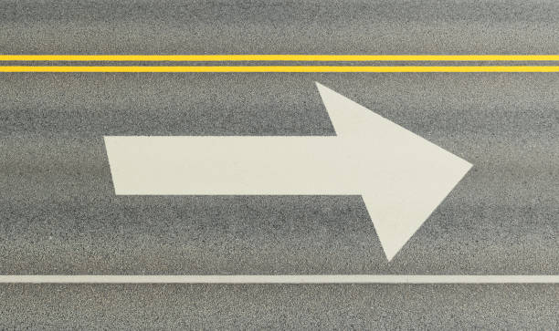 istock Into the future. New arrow painted on asphalt. Road markings 1071072352
