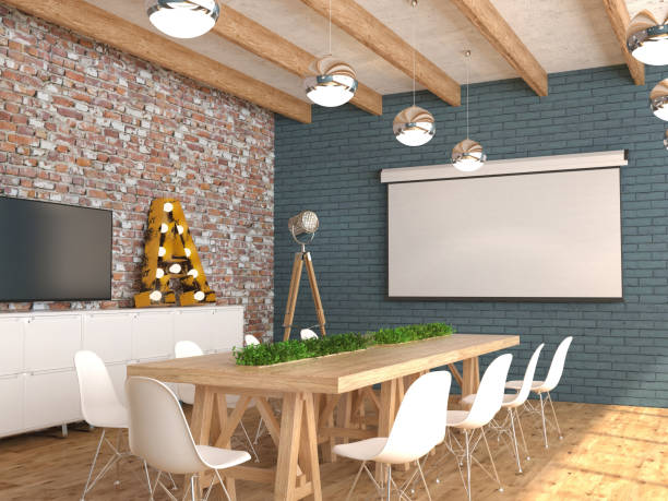 istock A meeting room with an empty white screen for the projector on the wall. 1071072444