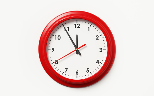 Reloj sobre fondo blanco con marco rojo photo