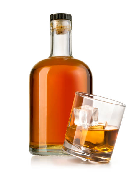 istock whiskey bottle with glass 1071075588