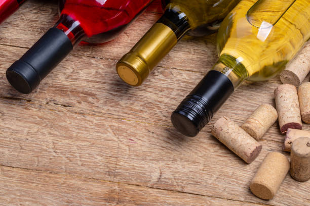 istock wine bottle and corks on wooden table 1071075632