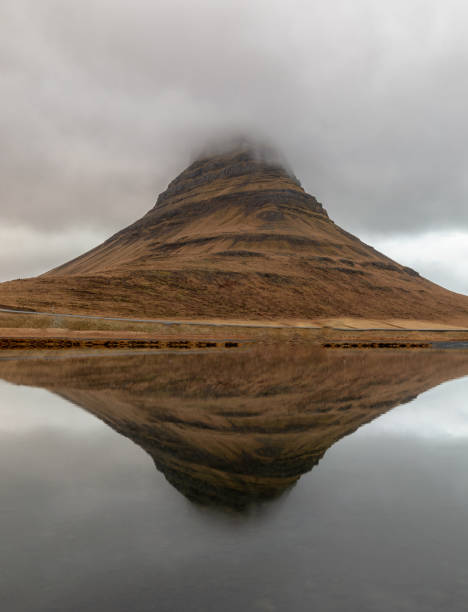 istock Kirkjufell mountain reflected at the sea in Iceland 1071078596