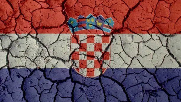 Political Crisis Or Environmental Concept: Mud Cracks With Croatia Flag