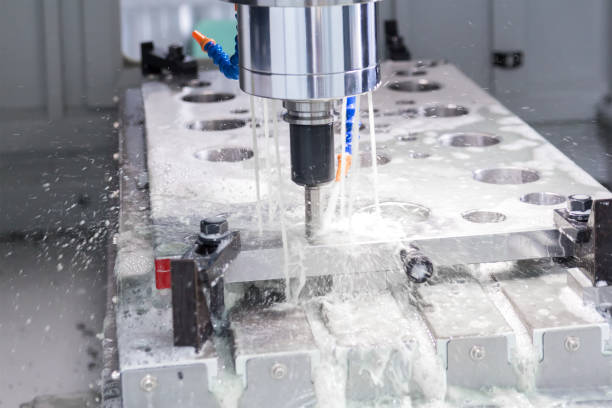 istock High precision CNC machining center working, operator machining die metal mold process 1071081662