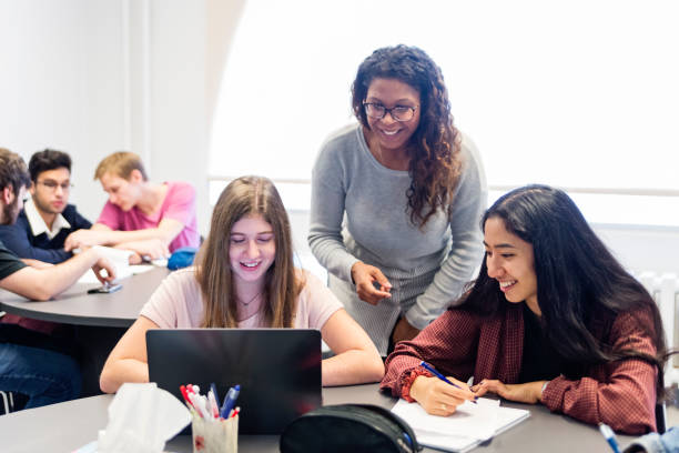 istock Multi-ethnic group of College students working in team in classroom. 1071084772