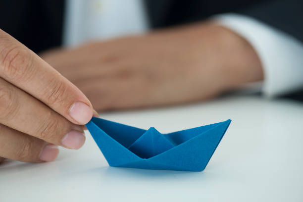 istock Businessman With Paper Boat 1071087022