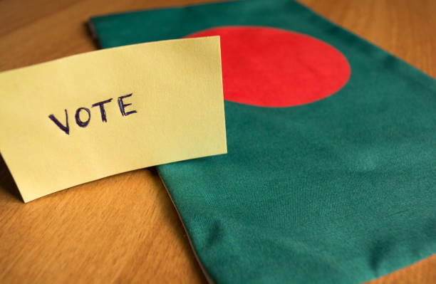 Voting concept - Hand Written Voting Sticker on Bangladesh Flag