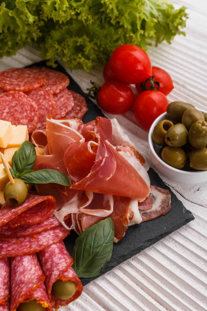 istock Cold smoked meat plate on a rustic wooden background 1071089762
