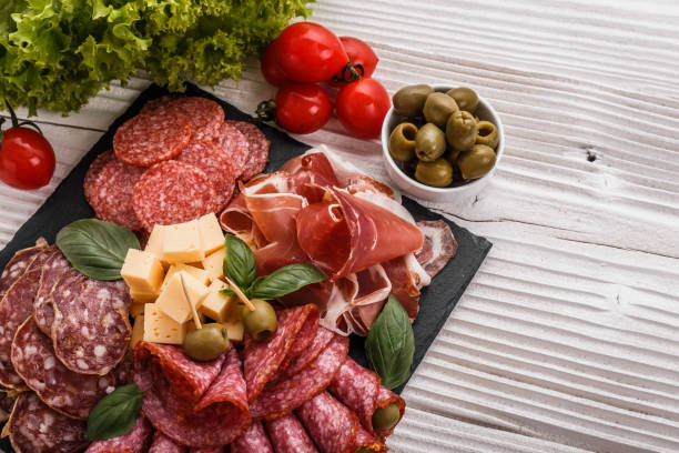 istock Cold smoked meat plate on a rustic wooden background 1071089808