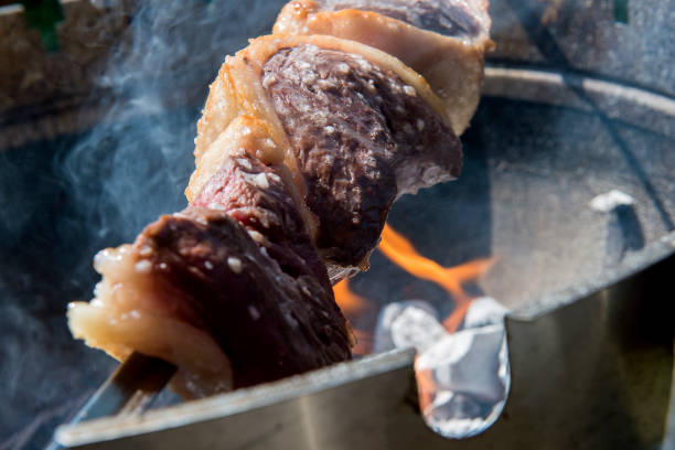 istock Picanha skewer cooks on the coals 1071091118