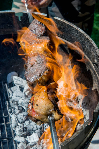 istock Picanha skewer cooks on the coals and flames 1071092944