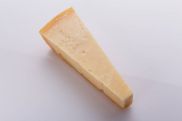 istock A fragrant parmesan piece on a white acrylic background 1071094098