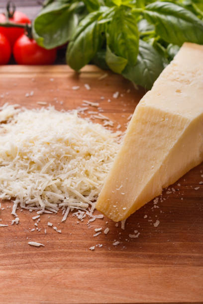 istock fragrant grated Parmesan on a wooden slicing board 1071095842