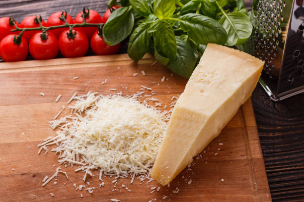 istock fragrant grated Parmesan on a wooden slicing board 1071095898