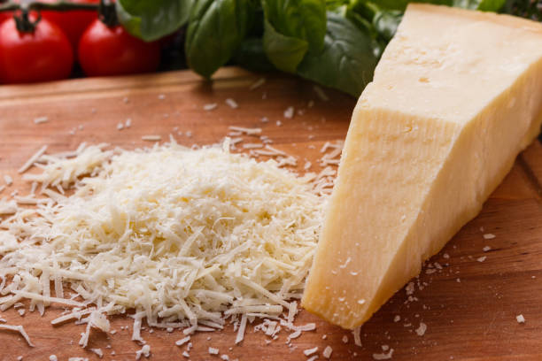 istock fragrant grated Parmesan on a wooden slicing board 1071095914