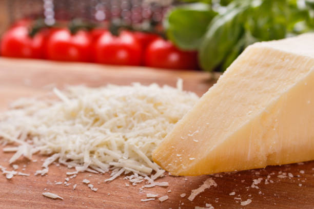 istock fragrant grated Parmesan on a wooden slicing board 1071095950