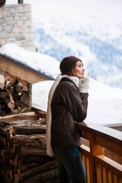 istock woman on a snowy balcony 1071096012