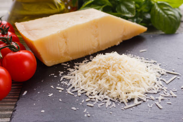 istock fragrant grated Parmesan on a slate stone slicing board 1071096084