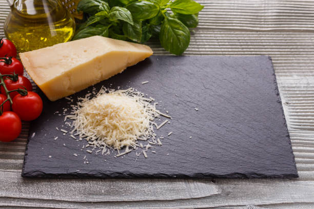 istock fragrant grated Parmesan on a slate stone slicing board 1071096128