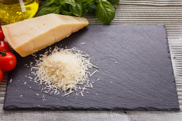 istock fragrant grated Parmesan on a slate stone slicing board 1071096238