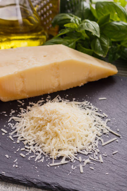 istock fragrant grated Parmesan on a slate stone slicing board 1071096266