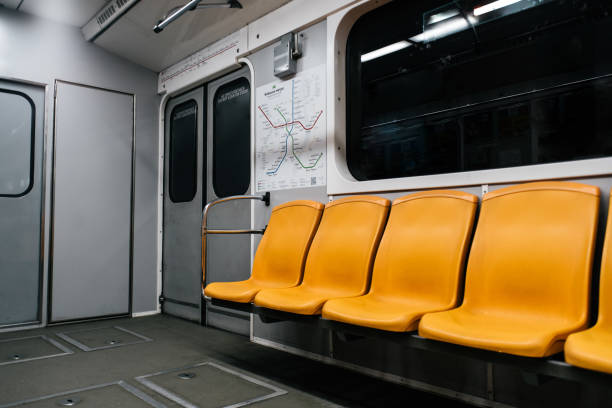 Kyiv metro wagon interior with no people and orange seats