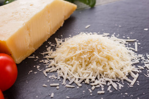 istock fragrant grated Parmesan on a slate stone slicing board 1071101844