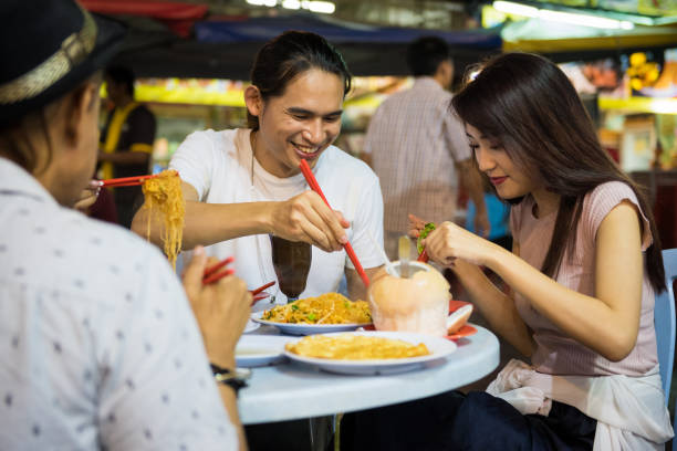 istock Eating at an Asian night market 1071102050