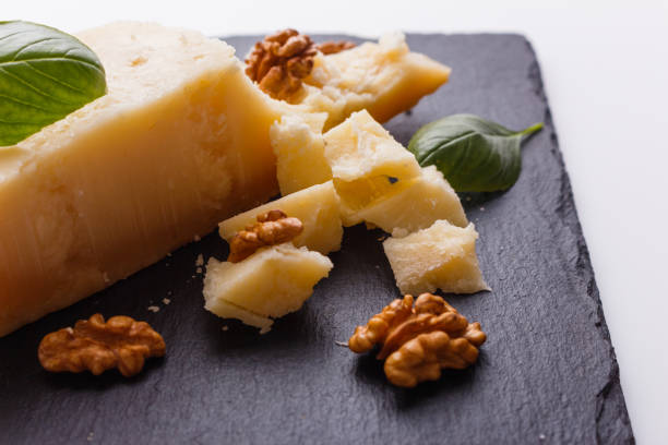 istock fragrant Parmesan on a slate stone slicing board 1071102348