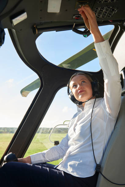 istock Female Pilot In Cockpit Of Helicopter Before Take Off 1071102486