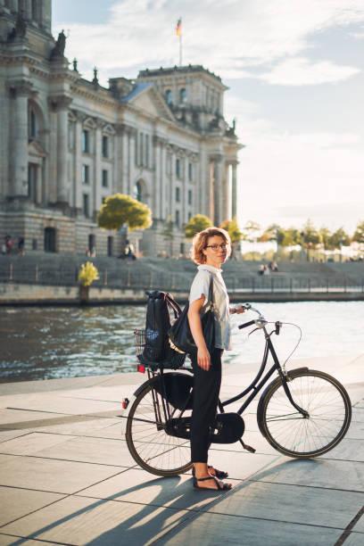 istock Happy woman with bicycle in Berlin 1071104736
