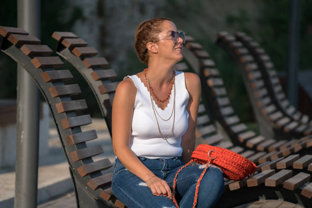 istock Beautiful mid adult having fun in park 1071105656