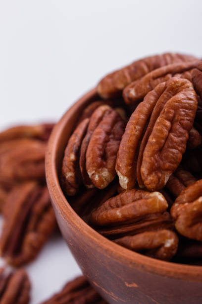 istock delicious pecan nuts on a white acrylic background 1071110724