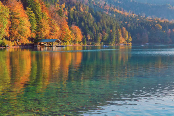 istock Beautiful blue mountain lake on a warm fall season day 1071111948