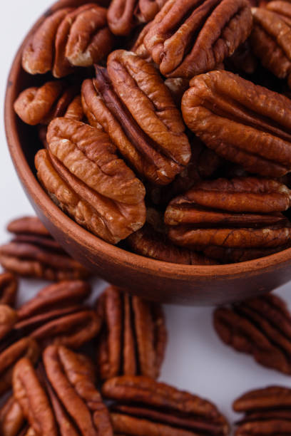 istock delicious pecan nuts on a white acrylic background 1071112102