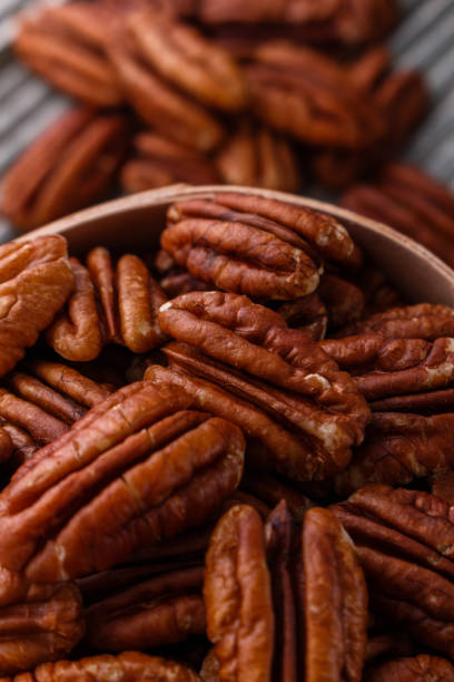 istock delicious pecan nuts on a rustic wooden background 1071112364