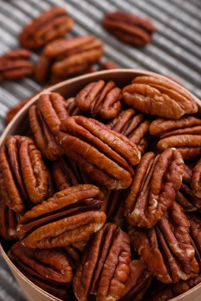 istock delicious pecan nuts on a rustic wooden background 1071112486