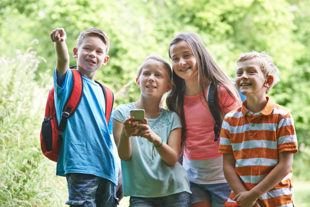 istock Group Of Children Geocaching In Woods 1071116160