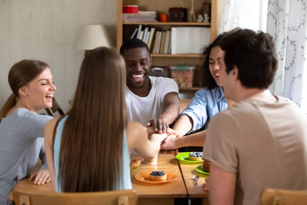 istock Diverse students stacked putting theirs hands together 1071116542