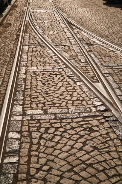 Crossroads tram tracks on a cobbled street in Poznan